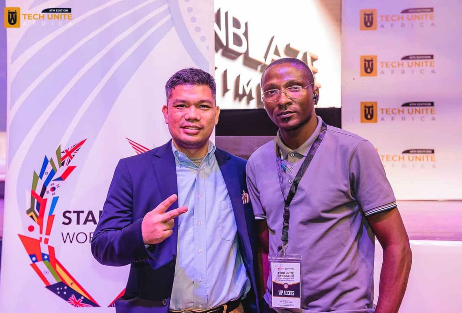 ANZOLO at tech unite africa leading the africa awakening standing side by side with a white man